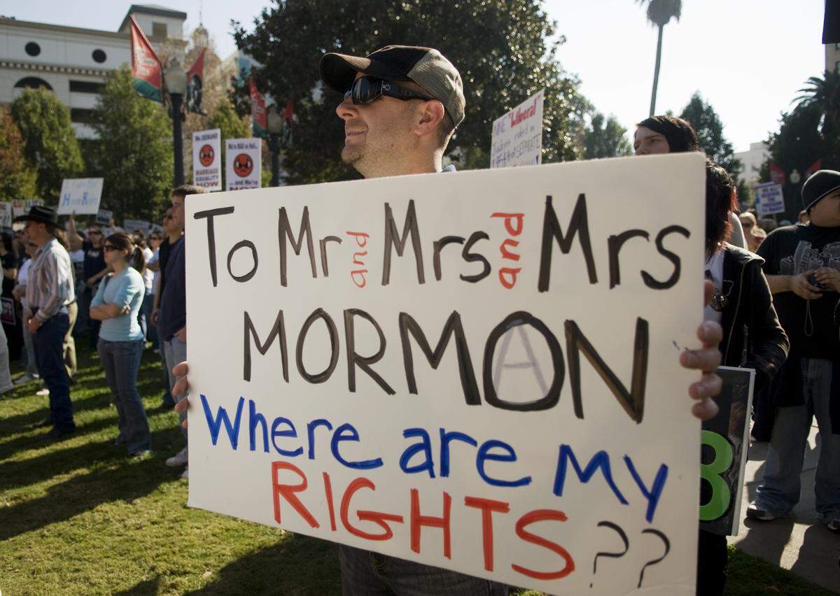 A man protests the Church of Jesus Christ of Latter-day Saints’ support of Proposition 8, the California ballot measure that banned same-sex marriage, at a demonstration in Sacramento in 2008. Amber Clark was suspended from her position at Granite Bay when she wouldn’t apologize for sharing a newsletter about LGBT resources that contained a link to a documentary about a gay Mormon teenager who lived through the Prop 8 campaign.
