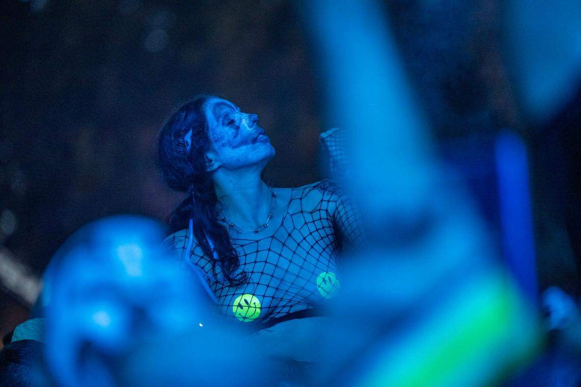 A festival attendee enjoys the music before Insane Clown Posse takes the stage in the first day of the Aftershock festival on Thursday, Oct. 10, 2024 at Discovery Park.