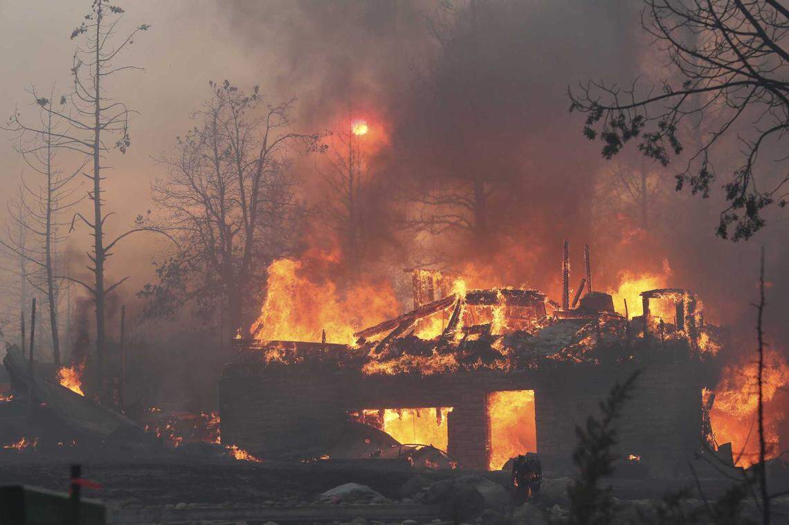 A residence goes up in flames as the Mill Fire causes damage in the Lake Shastina subdivision northwest of Weed, Calif., on Friday, Sept. 2, 2022.