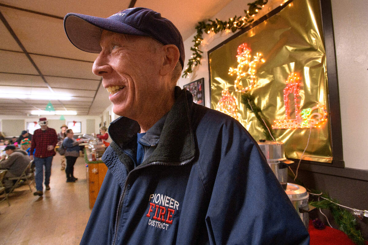 Pioneer Fire District volunteer firefighter Paul Schaffer keeps an eye on the activity during Breakfast with Santa, an event put on by the Pioneer Volunteer Firefighters Association and the West Slope Foundation earlier this month.