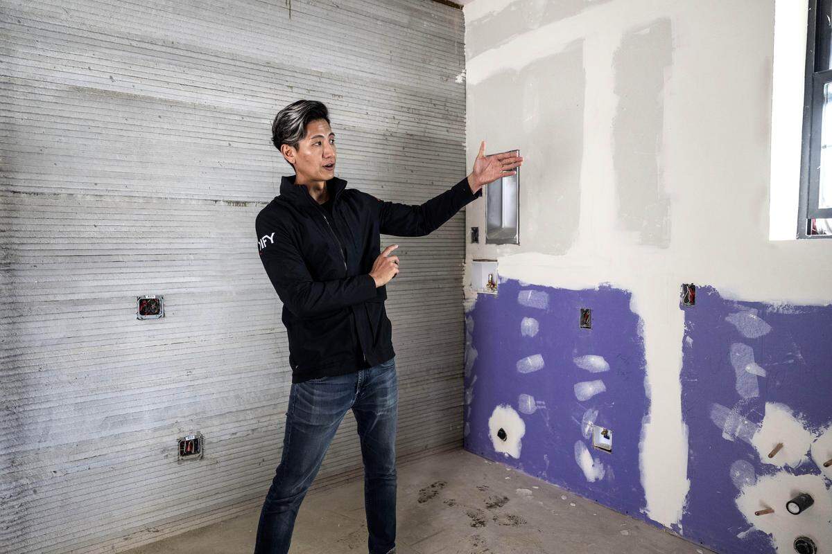 Nan Lin, the project developer and owner of 4dify, demonstrates the kitchen area of the first 3D printed home in Yuba County on Thursday.