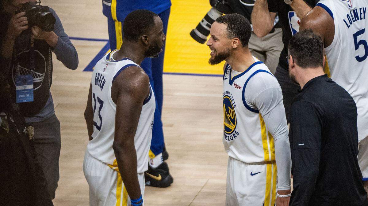 Golden State Warriors forward Draymond Green (23) and teammate guard Stephen Curry (30) celebrate their 126-125 victory during Game 4 of the first-round NBA playoff series at Chase Center in San Francisco on Sunday, April 23, 2023.