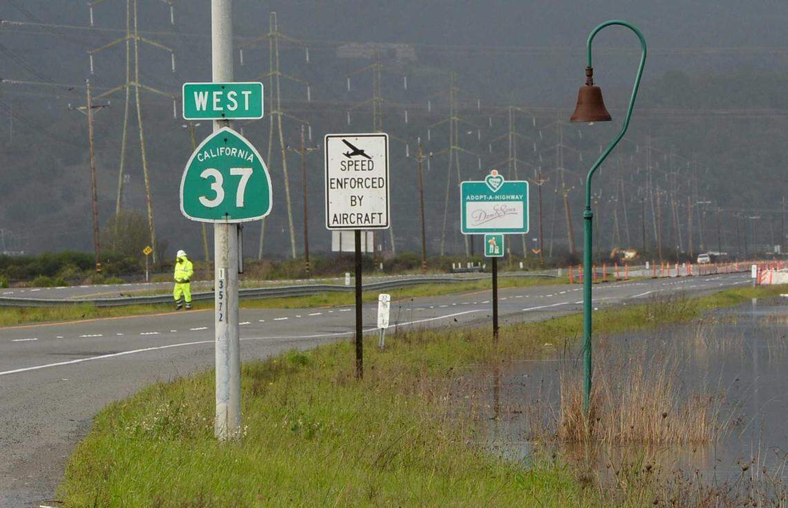 Water stands near the shoulder of Highway 37 in Novato after a storm on Wednesday, Feb. 27, 2019. A section of the road was closed due to flooding. Caltrans' current plan would not elevate the highway enough to prevent future flood closures, which experts warn will become more common due to climate change and levee failure.