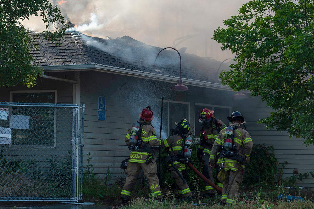 Firefighters work to put out a two-alarm commercial fire at 5060 Madison Avenue on Monday, May 2, 2022, in North Highlands. The fire started about 5:30 p.m. and quickly went two-alarm. They were able to contain it to the one building with no injuries reported, according to Capt. Parker Wilbourn, Sac Metro Fire.