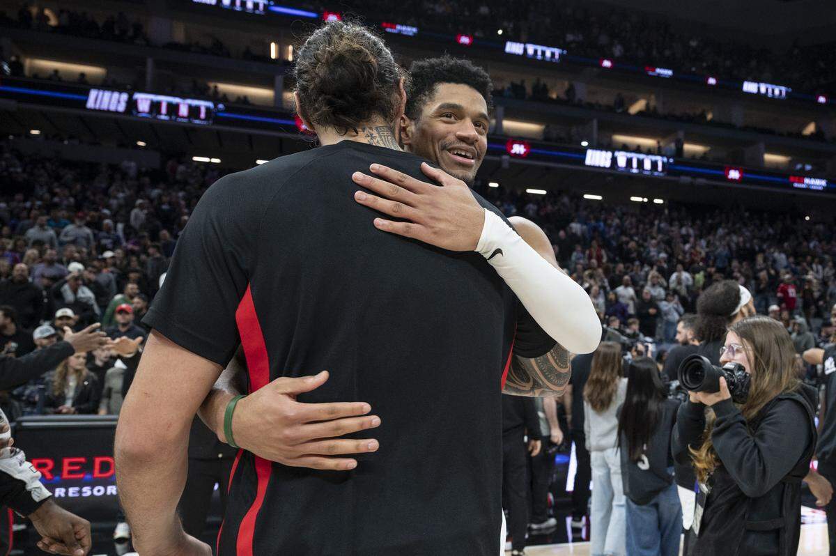 Sacramento Kings center Dylan Cardwell (32) hugs Houston Rockets center Steven Adams (12) after the Kings beat the Rockets at Golden 1 Center in Sacramento on Sunday, Jan. 11, 2026.