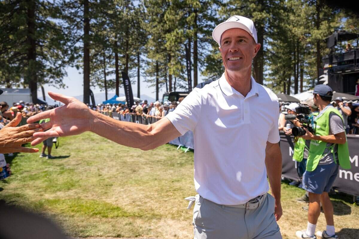 NFL Gameday Morning host Rich Eisen slaps a fan’s hand during the American Century Championship celebrity golf tournament at Edgewood Tahoe Resort in Stateline, Nev., on Friday, July 11, 2025.
