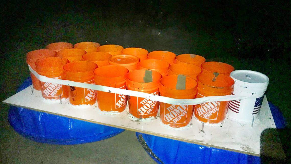 California officials rescued two students in their 20s after they were stranded 900 feet from the shore in a boat made of duct tape, buckets and kiddie pools.