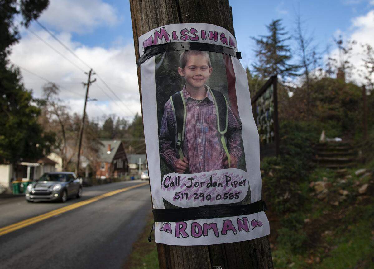 A missing sign is posted on a telephone pole Monday, Jan. 13, 2020, near the home of Roman Anthony Lopez, an 11-year-old Placerville boy who went missing on Jan. 11, 2020, and was later found dead in the basement of his home on Coloma Street in Placerville.