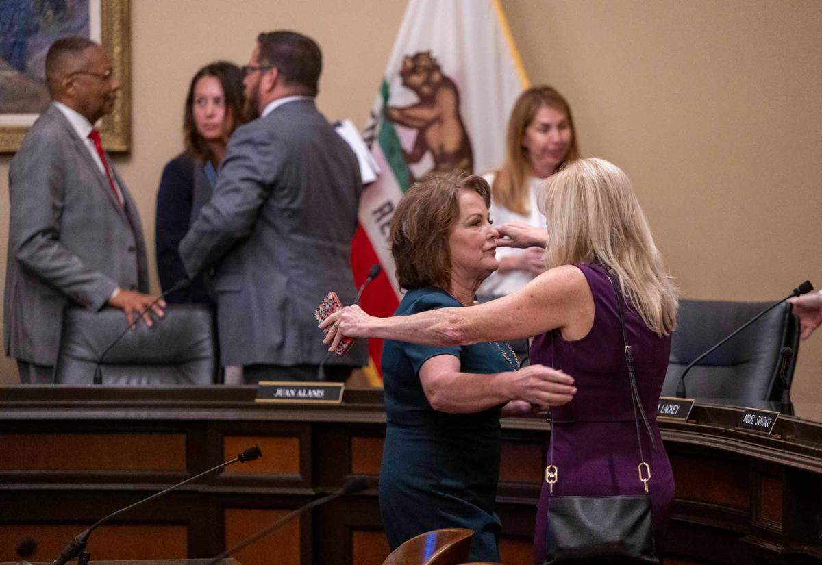 Sen. Shannon Grove, R-Bakersfield, is hugged by California Assemblymember Laurie Davies, following a vote to revive her child sex trafficking bill during an emergency Assembly Public Safety Committee hearing at the Capitol on Thursday.