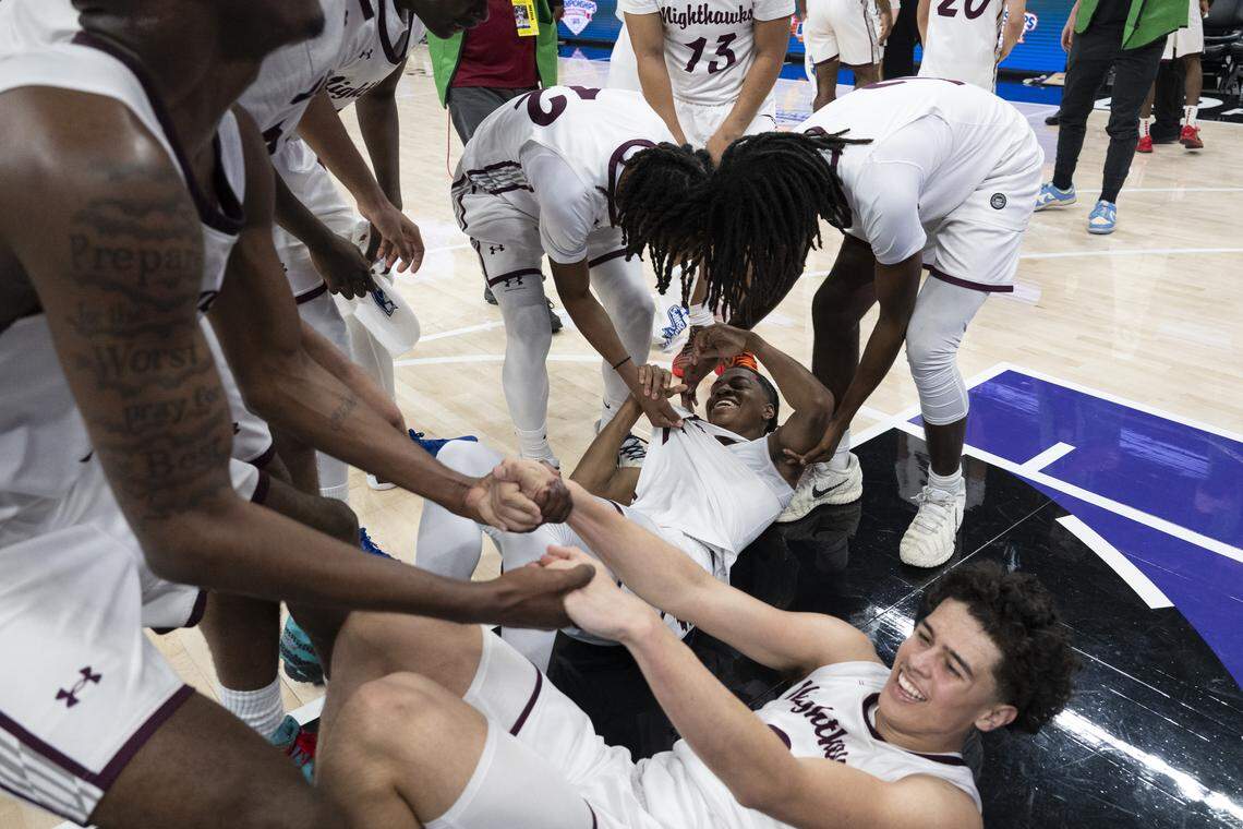 The Natomas Nighthawks celebrate after winning the CIF Sac-Joaquin Section Division IV boys basketball championship at Golden 1 Center in Sacramento on Friday.