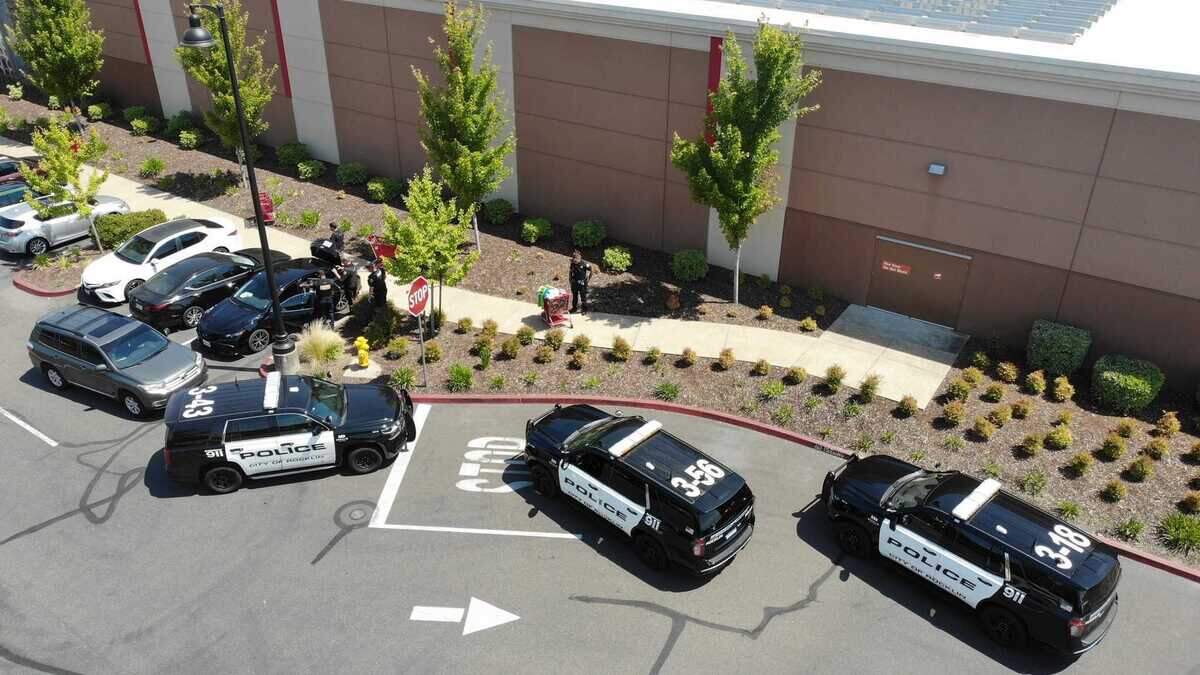 Rocklin Police Department officers sift through merchandise allegedly stolen by two female suspects outside of Target on Commons Drive on Tuesday, June 27, 2023. The suspects were arrested and booked into Placer County Jail on burglary and conspiracy charges.