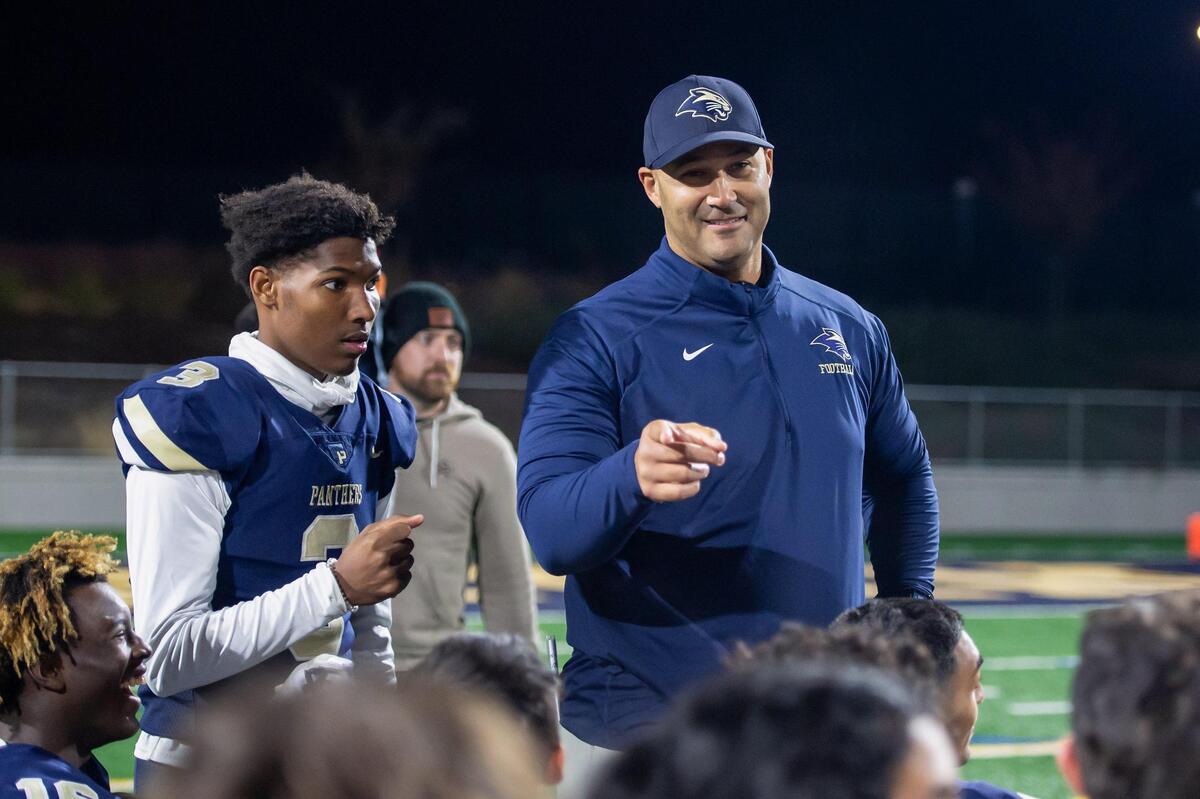 West Park Panthers coach Jason Tenner talks with the team after the CIF Sac-Joaquin division IV quarterfinals playoff game against the Nevada Union Miners on Friday, Nov. 11, 2022, at West Park High School in Roseville. The Panthers won 58-28.