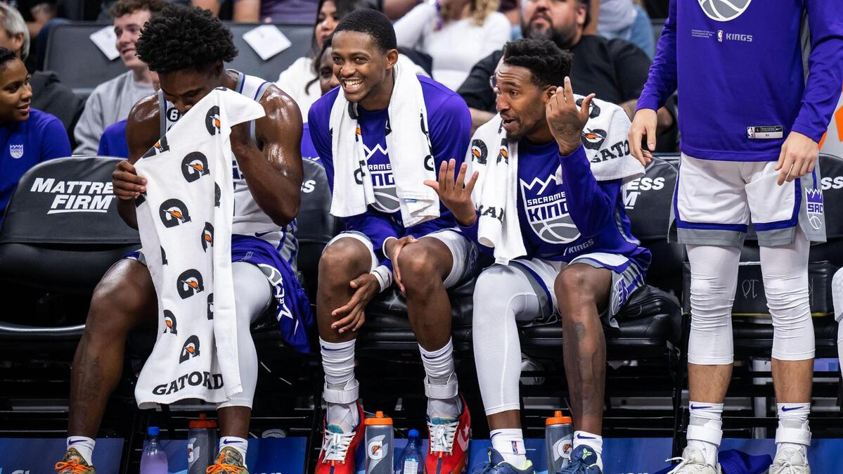 Sacramento Kings guards, from left, Davion Mitchell, De’Aaron Fox and Malik Monk show a buoyant mood on the bench in the fourth quarter as the Kings rout the Los Angeles Lakers during their last preseason NBA basketball game Friday, Oct. 14, 2022, at Golden 1 Center in Sacramento.