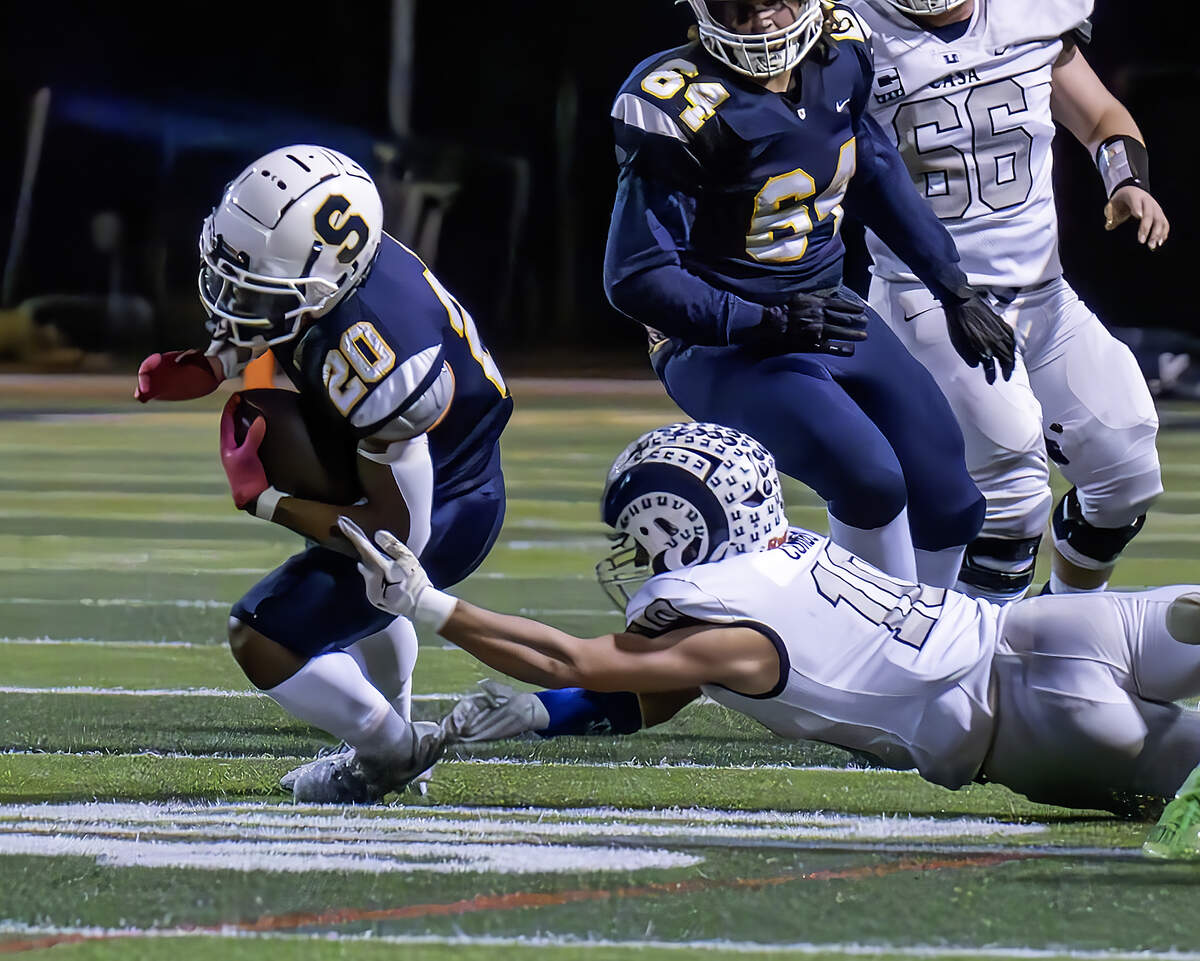 Casa Roble’s Evan Combs tackles Soquel’s Tyreis Lundy in the CIF Northern California Division 4-AA championship game in Soquel on Friday, Dec. 1, 2023.