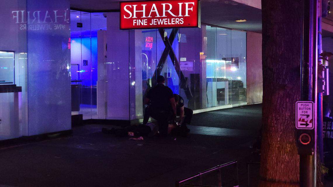 First responders treat a victim at the scene of a mass shooting in downtown Sacramento on Sunday.