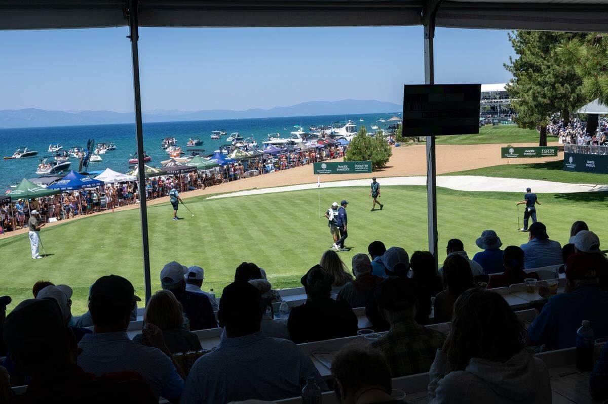 Saturday Night Live’s Colin Jost, right, reacts after he pars the 17th hole during the American Century Championship celebrity golf tournament at Edgewood Tahoe Resort on Friday.