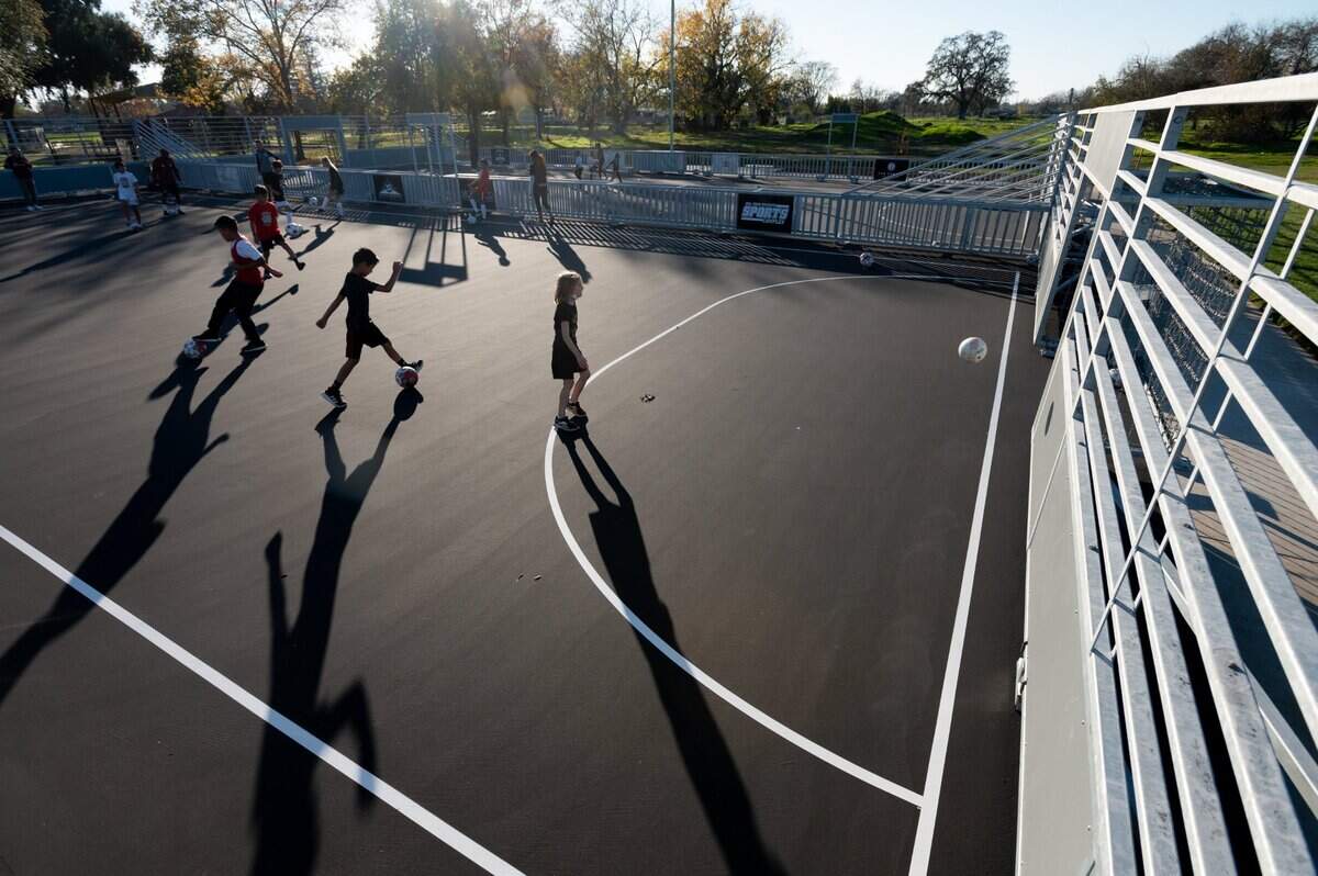 Children participate in a soccer workshop with Sacramento Republic FC clinics coaches Monday, Nov. 29, 2021, the opening day of the Del Paso Heights Sports Complex in Sacramento.