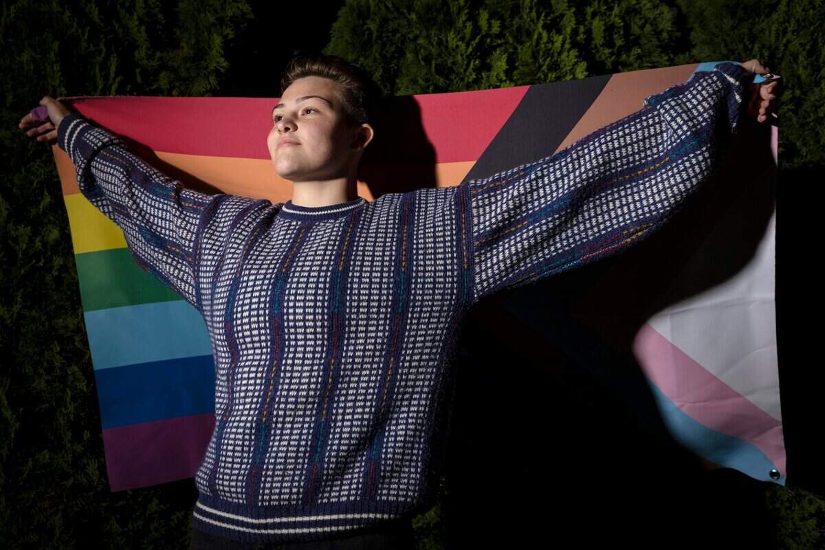 2. Emma Houle, 16, holds the rainbow gay pride flag at home in Arden Arcade on Monday, Oct. 11, 2021. A senior at St. Francis Catholic High School, Houle is the school’s first openly queer homecoming princess.