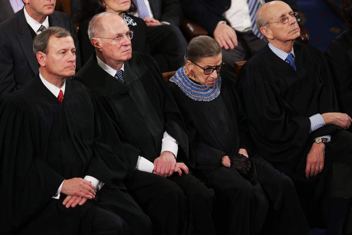 WASHINGTON, DC - JANUARY 20: (L-R) U.S. Supreme Court Chief Justice John Roberts, Justice Anthony Kennedy, Justice Ruth Bader Ginsburg and Justice Stephen Breyer listen as U.S. President Barack Obama delivers his State of the Union speech before members of Congress in the House chamber of the U.S. Capitol on January 20, 2015 in Washington, DC. Obama presented a broad agenda including attempts to address income inequality and making it easier for Americans to afford college education and child care. (Photo by Alex Wong/Getty Images)