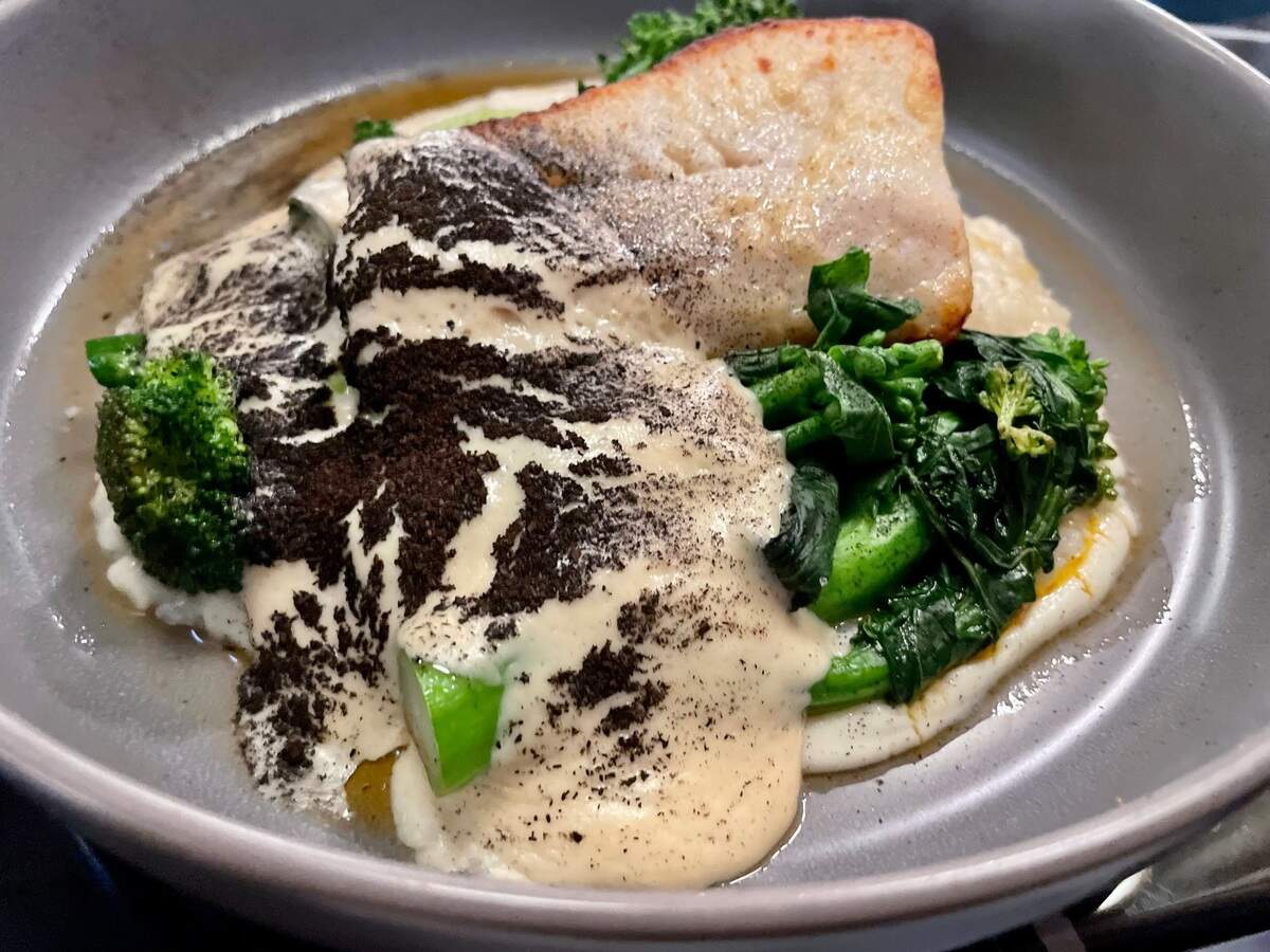 Pacific black cod ($43), served over a reduced congee base with broccolini at V’s Paradise.