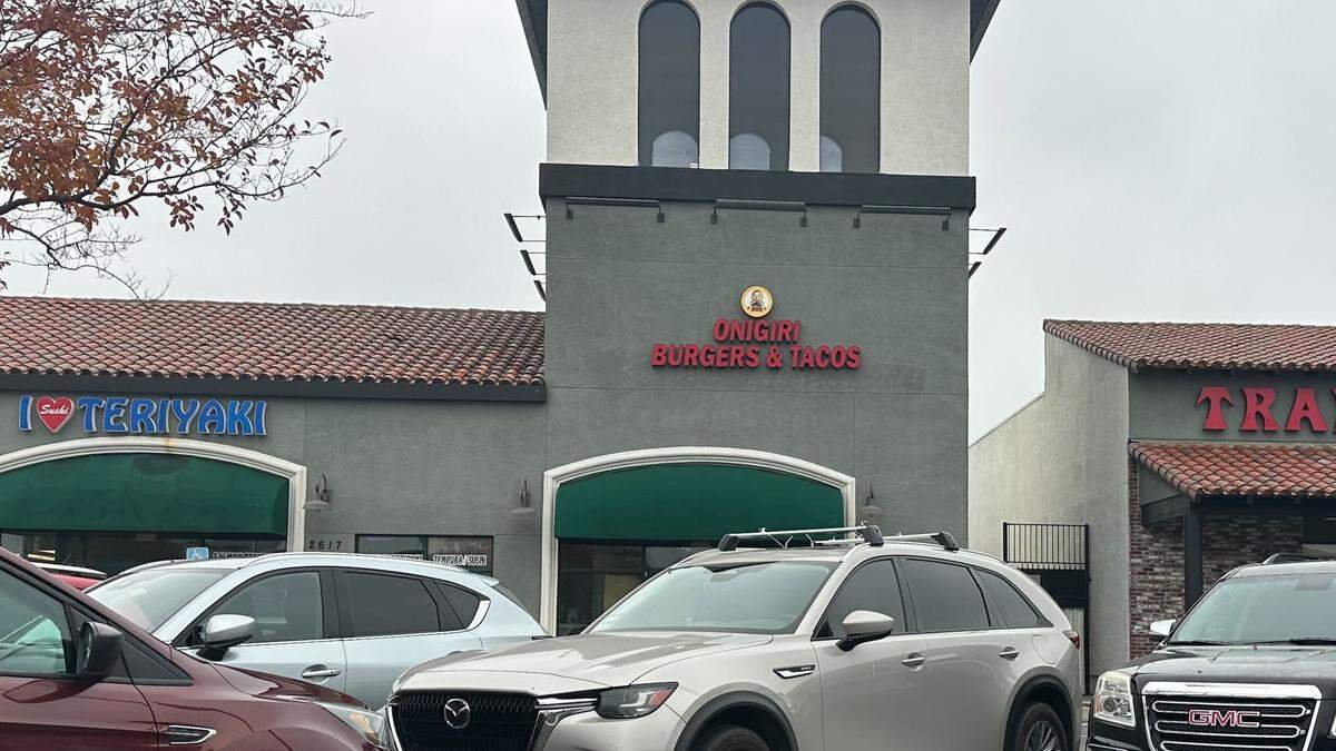 A sign for Onigiri Burgers and Tacos is displayed at 2621 Marconi Ave., at the Town & Country Village shopping center in Arden Arcade, As of Nov. 30, 2025, the restaurant was still not open, but its counterpart on Freeport Boulevard has been operating since mid-November.