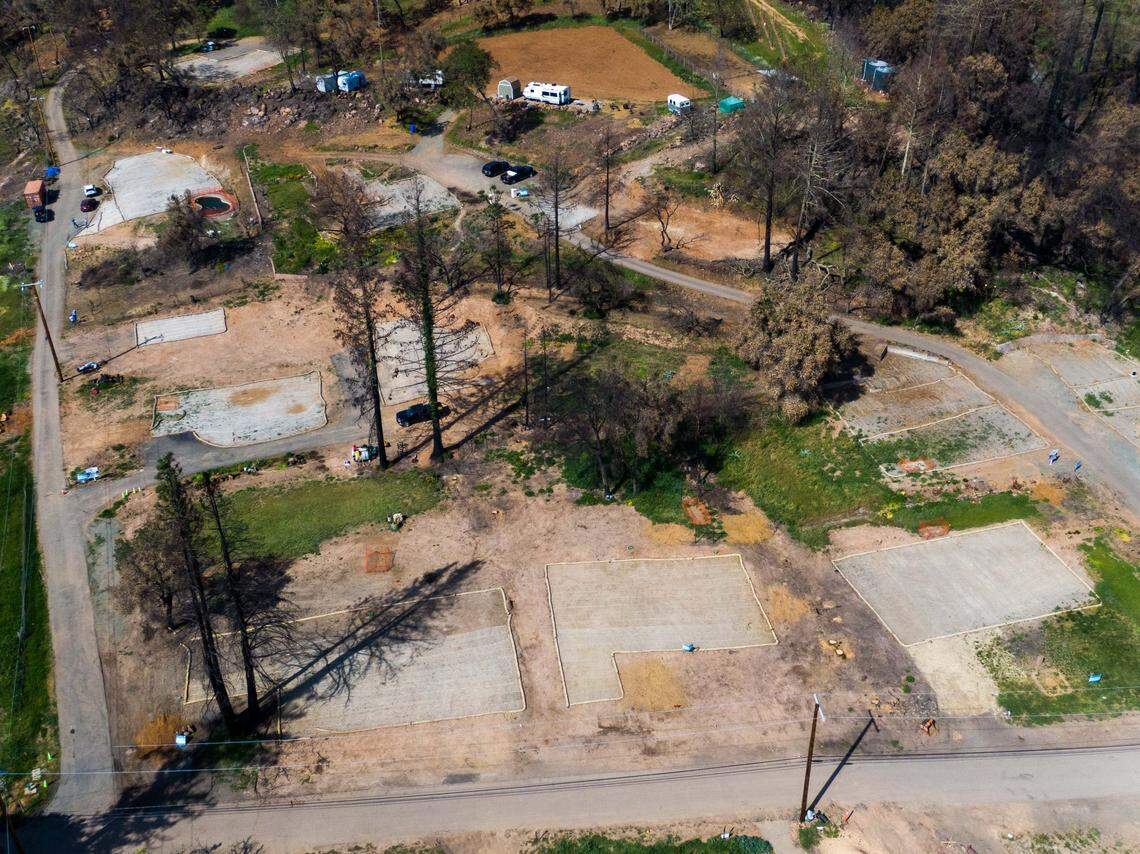 The footprints of Napa County homes on Sunnyside Road burned in the Glass Fire in September are visible in April as residents work on their plans to rebuild. With the cost of building materials soaring, many homeowners are finding themselves under-insured.