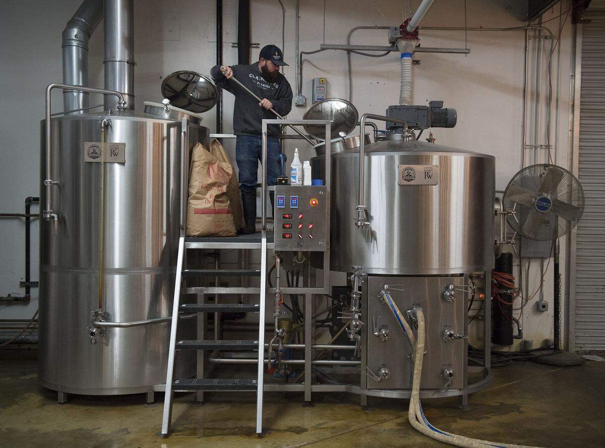 Co-owner Brian Palmer mixes oats into a batch of a hazy style beer at Claimstake Brewing in Rancho Cordova in 2016. It’s the oldest active brewery on the Sunrise Boulevard corridor.