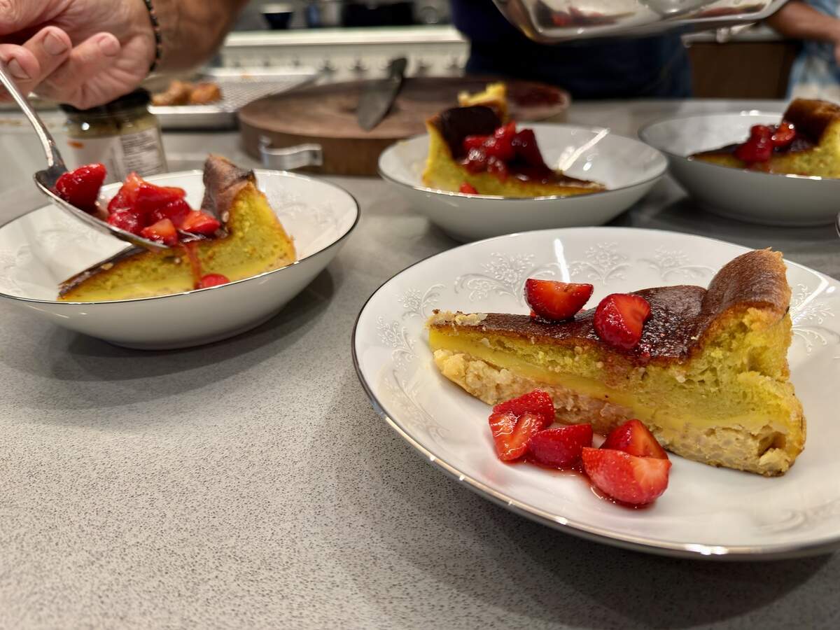 Chef Paul Ladeira adds strawberries to a dessert made of a rice pudding combined with a Portuguese pao de lo at Blue Ruby Farm in Browns Valley in March.