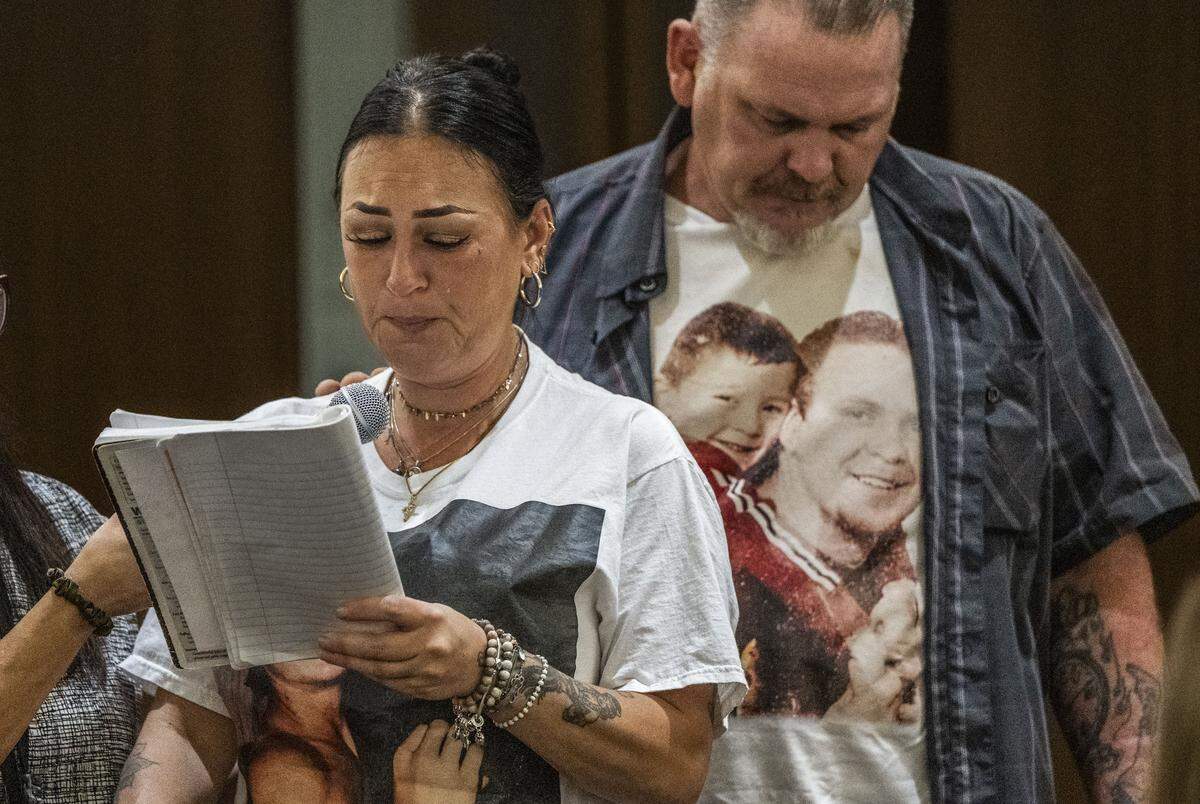 Crystal Shearer, mother of Corey Shearer, reads an impact statement during the sentencing for Amyis Ausar Coogler, 21, on Friday as her husband Ricky supports her.