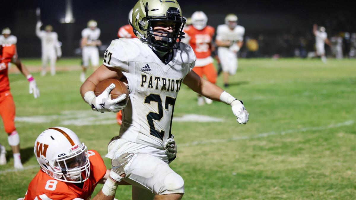 Pioneer running back Jack Carner carries the ball at Woodland High School last year on his way to an All-Metro season. He racked up 1,390 yards and 18 touchdowns as a junior.
