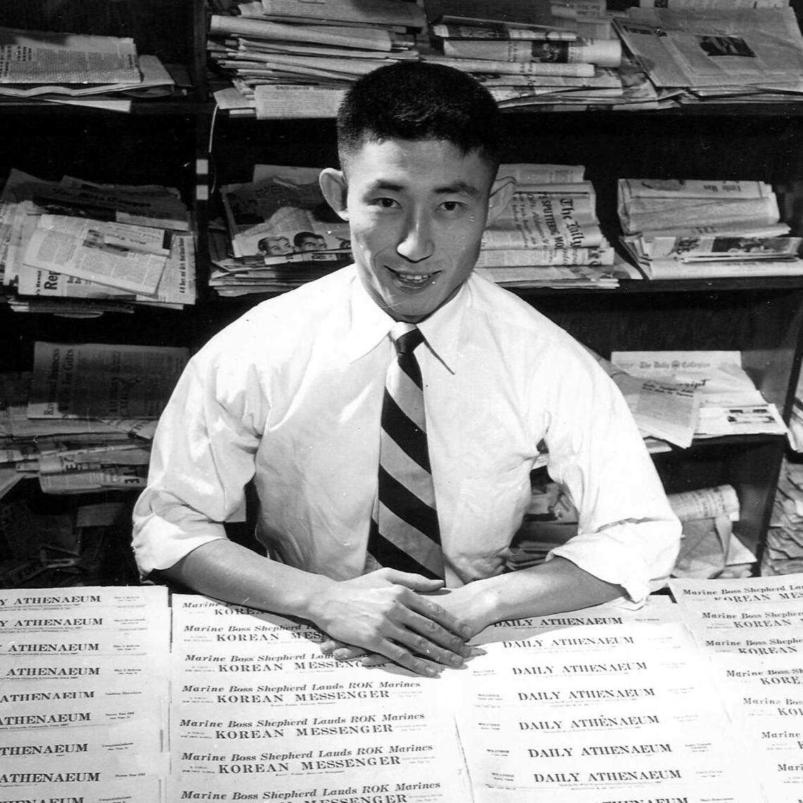 K.W. Lee is seen in 1952 with copies of the Korean Messenger newspaper he created during his education at West Virginia University. Lee, a pioneering journalist who championed the underdog and battled corruption at the Sacramento Union and other newspapers, died March 8 at 96.
