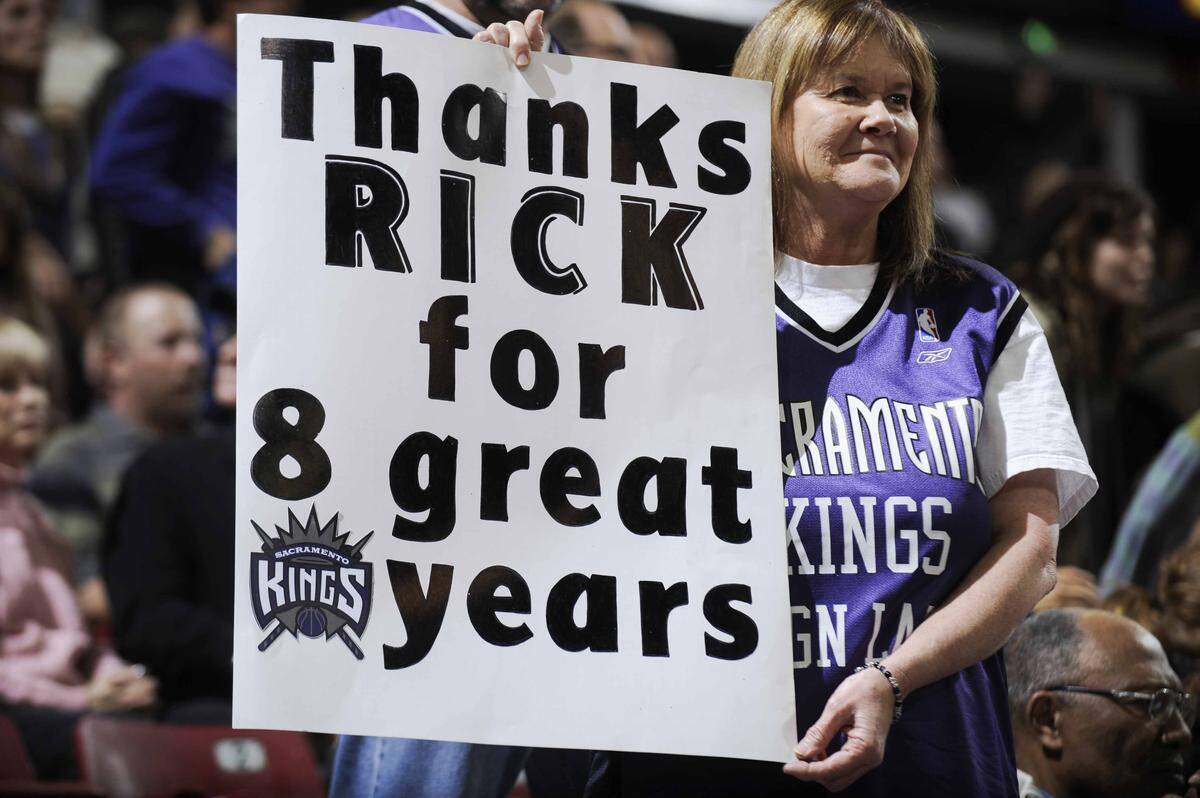 A Sacramento Kings fan holds up a sign in support of former Kings coach Rick Adelman at Arco Arena on Dec. 1, 2007.