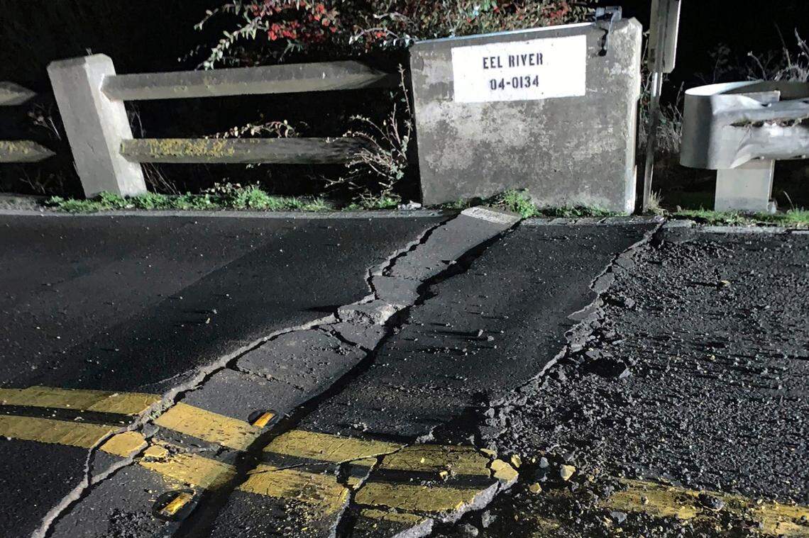 This image posted by Caltrans District 1 shows a road closure on California State Route 211 at Fernbridge, a 1,320-foot-long (402.3 m) concrete arch bridge that spans the Eel River near Fortuna, Calif., in Humboldt County. The bridge is closed while they conduct a safety inspection checking for possible seismic damage. Officials say a strong earthquake in Northern California has cut off power to thousands and damaged roads and homes. No injuries have been reported in the magnitude 6.4 earthquake early Tuesday near Ferndale. That’s a small community over 200 miles northwest of San Francisco and close to the Pacific Coast. (Caltrans District 1 via AP)
