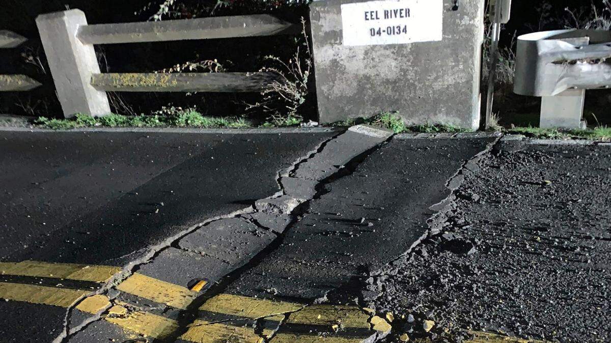 This image posted by Caltrans District 1 shows a road closure on California State Route 211 at Fernbridge, a 1,320-foot-long (402.3 m) concrete arch bridge that spans the Eel River near Fortuna, Calif., in Humboldt County. The bridge is closed while they conduct a safety inspection checking for possible seismic damage. Officials say a strong earthquake in Northern California has cut off power to thousands and damaged roads and homes. No injuries have been reported in the magnitude 6.4 earthquake early Tuesday near Ferndale. That’s a small community over 200 miles northwest of San Francisco and close to the Pacific Coast. (Caltrans District 1 via AP)
