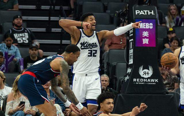 Sacramento Kings center Dylan Cardwell (32) disputes a foul call against the Los Angeles Clippers during the second half at Golden 1 Center on Sunday.