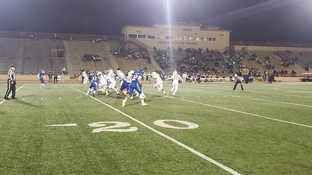 Takeshi Faupula runs into the Christian Brothers defense during Yuba City’s 54-19 win Friday night.
