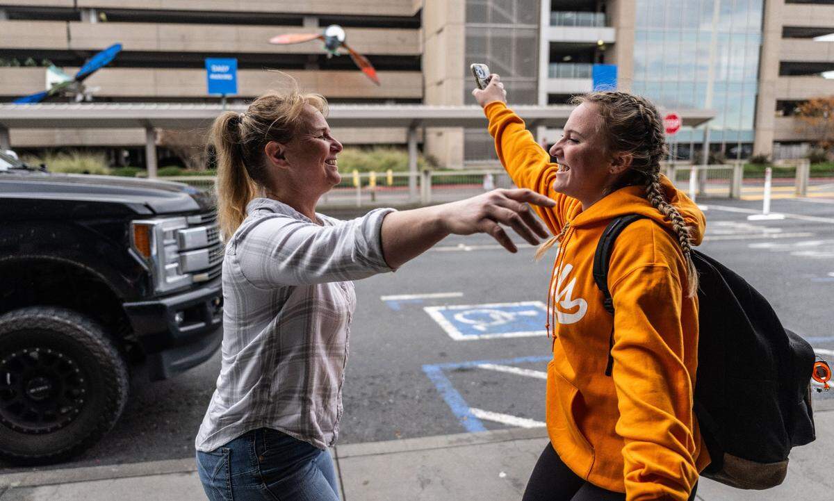 Amanda Blake, a sophomore at University of Tennessee, hugs her mother Chantal of Colfax at the Sacramento International Airport Terminal A on Tuesday, Nov. 26, 2024.