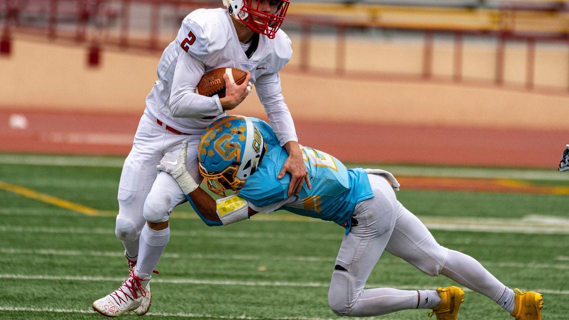 Center High School Cougars Latrell Harris (2), tackles Ripon Indians Brandon Rainer (2), as the Center High School Cougars host the Ripon Indians in the Sac-Joaquin Section Division V final Football game at Hughes Stadium in Sacramento, CA., Saturday, November 30, 2019.
