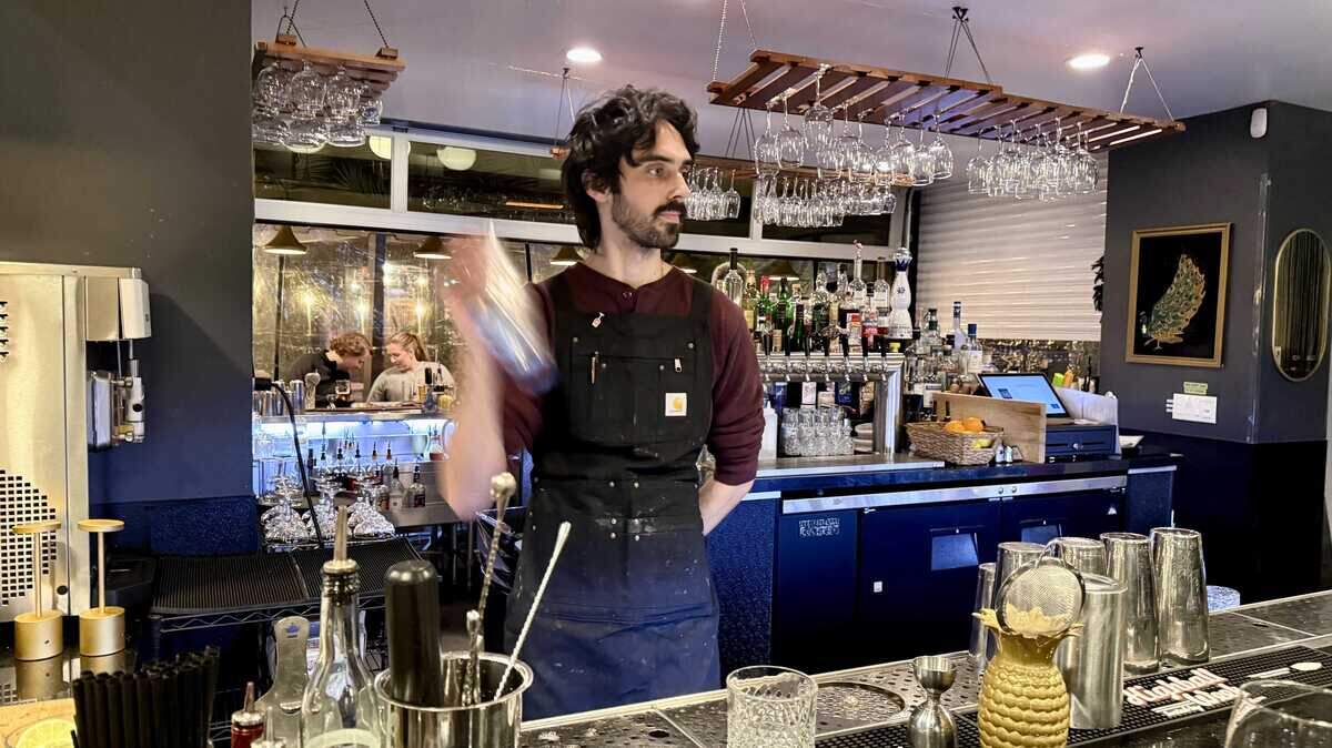 Shangri-La bartender Ray Carrasco shakes up a happy hour cocktail on Wednesday, Jan. 7. The restaurant pivoted its service model in order to keep prices approachable for regular customers.