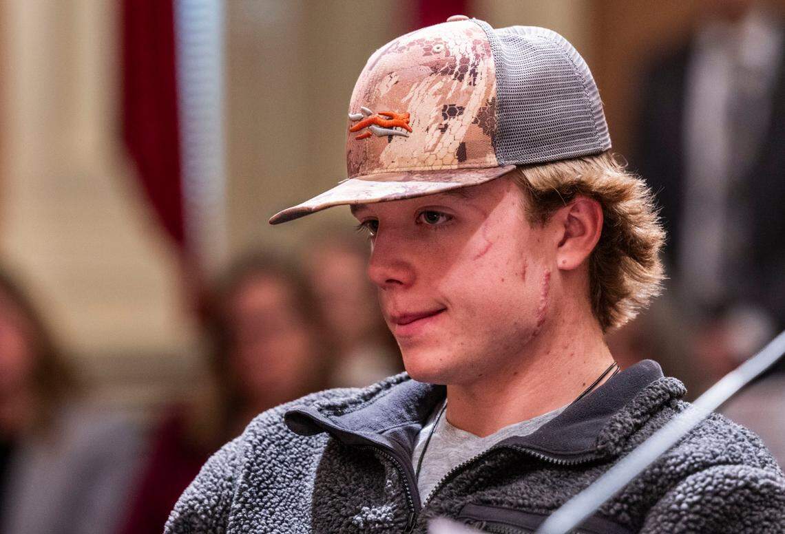 Wyatt Brooks, of El Dorado County, listens to testimony for Senate Bill 818, “Taylen and Wyatt’s Law,” on Tuesday at the state Capitol. Wyatt was injured by a mountain lion that killed his brother last year. SB 818 would allow trained dogs and their handlers to chase away mountain lions.