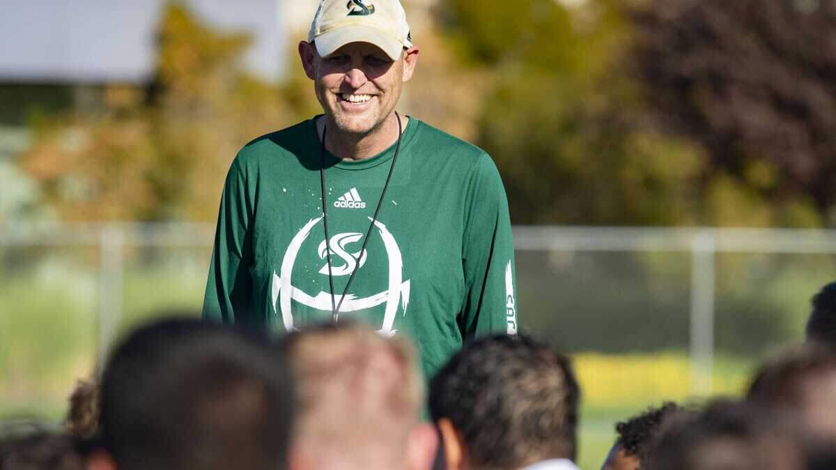 Sacramento State’s head coach Troy Taylor working with the Hornets during practice in August 2019. The coach had to sit on the sidelines this spring amid the coronavirus pandemic.