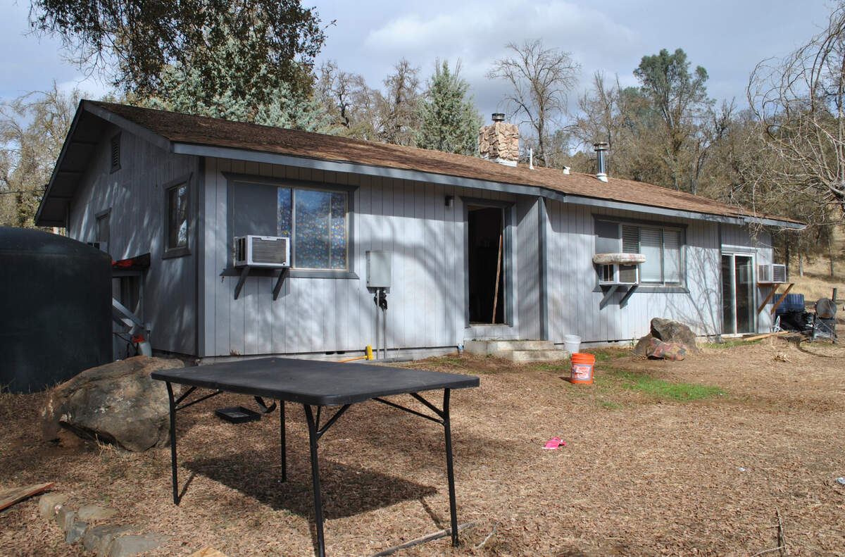 This Mariposa County home on Old Highway road is one of the 20 properties in the county owned by the Saratoga Group that has been raided for illegal marijuana grows.