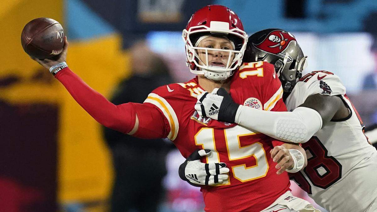 Kansas City quarterback Patrick Mahomes passes under pressure from Tampa Bay linebacker Shaquil Barrett during the Super Bowl.