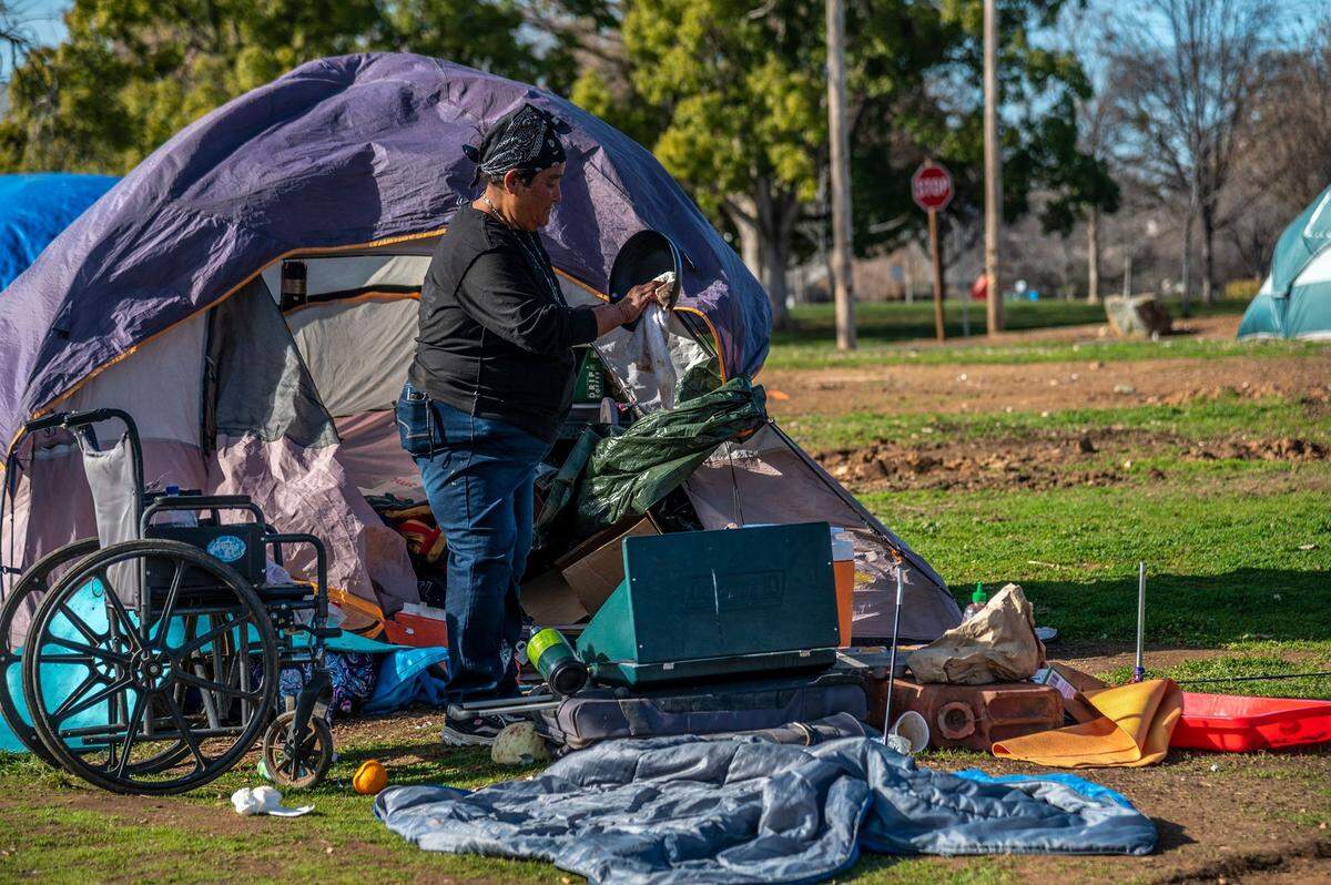 Angela Wells, 57, said there was no running water and no place to get water at a homeless encampment in Auburn on Jan. 21. “They cut off all the taps and capped them,” she said. “You get arrested if you go get water from the faucets and they have pulled everything you can use.”