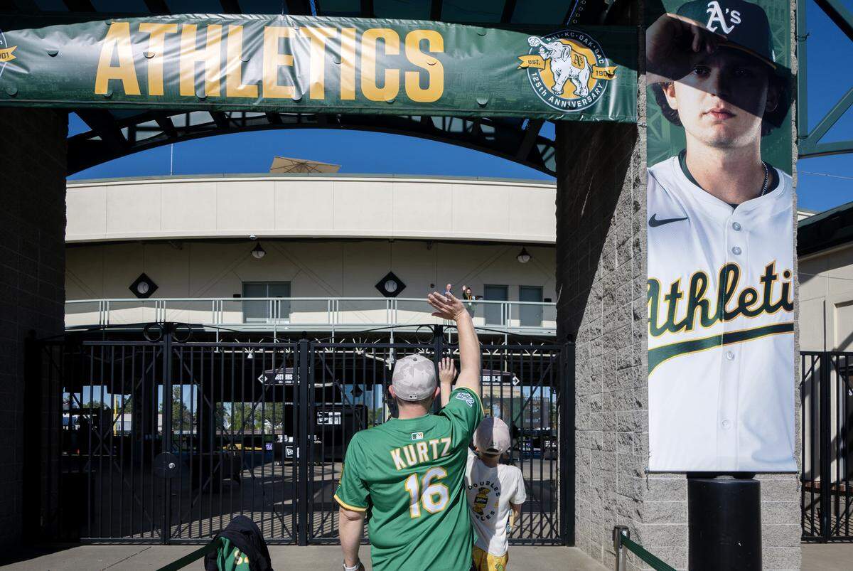 Nate McGuire and his son Declan were first in line to enter Sutter Health Park in West Sacramento for the Athletics home opener Friday against the Houston Astros.