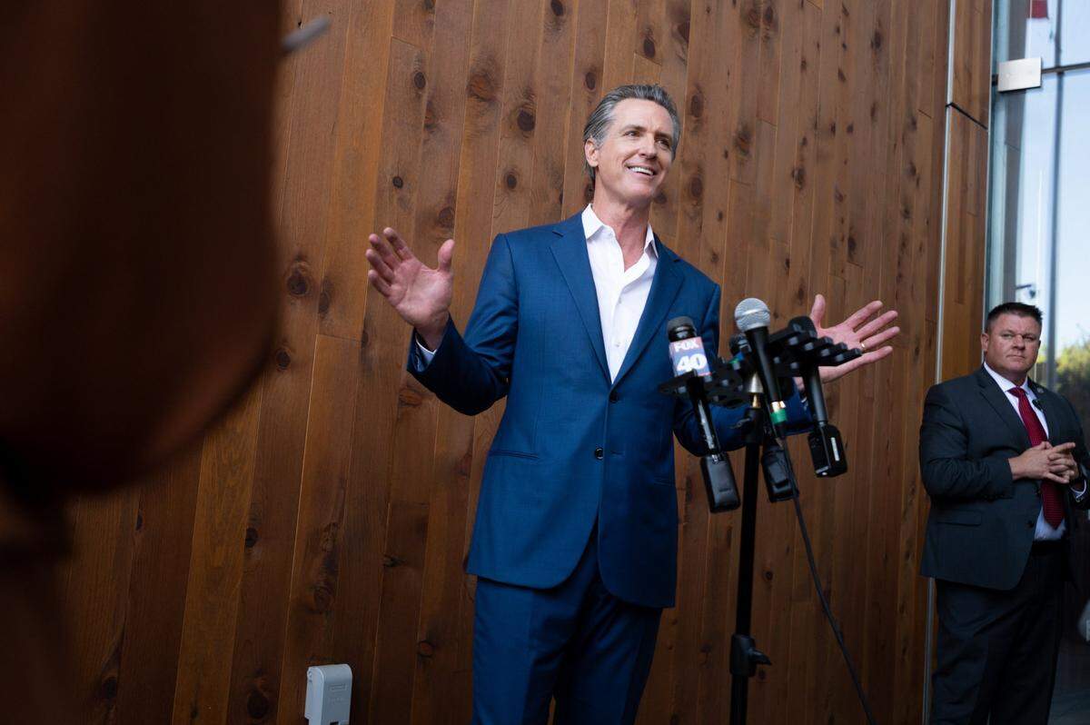 Gov. Gavin Newsom called on Friday for state legislators to convene in Sacramento in December to levy a new tax on oil companies that would fund rebates for California taxpayers getting squeezed at the pump.