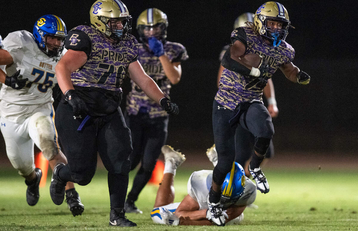 The Bradshaw Christian Pride's Devin Hatcher (2) picks up a big gain on a draw play in the fourth quarter against the Sutter Huskies in Vineyard on Friday.