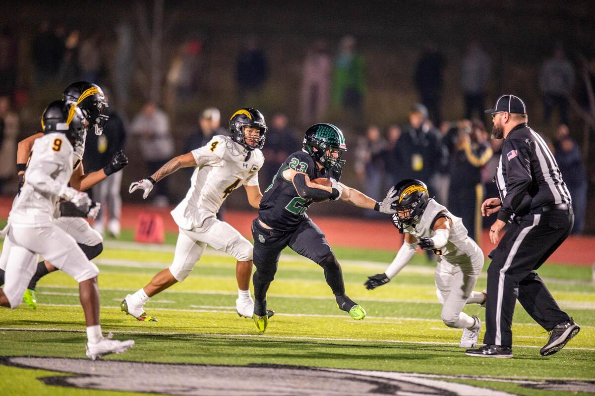 The Twelve Bridges Raging Rhinos’ Braeden Ward (23) breaks several tackles against the Wilcox Chargers during a long run in the fourth quarter of the CIF Northern California Division 2-A championship game on Saturday, Dec. 7, 2024, in Lincoln.