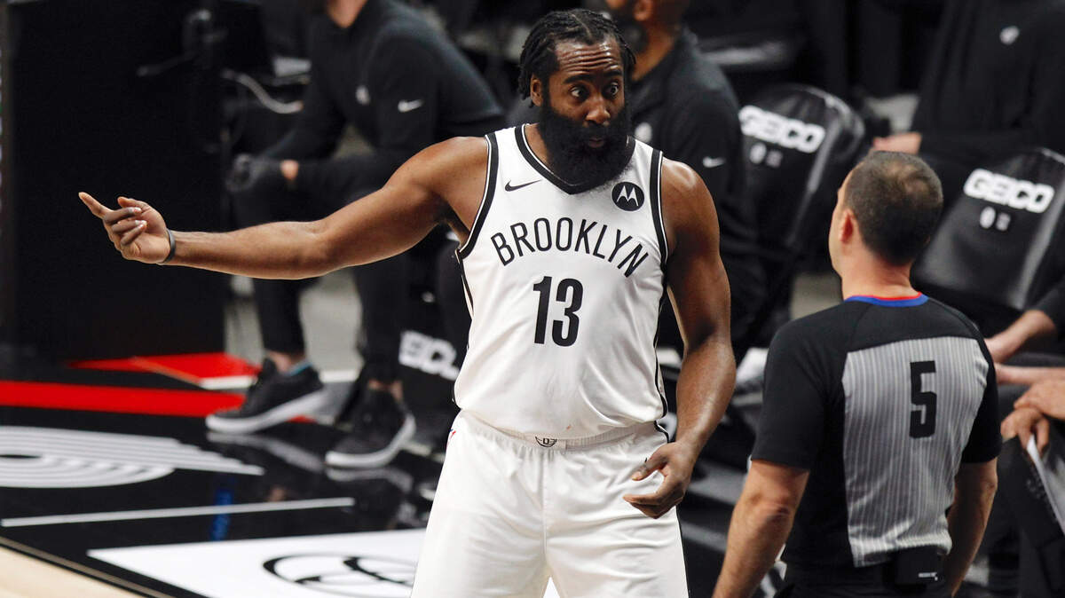 Brooklyn Nets guard James Harden, left, pleads with referee Kane Fitzgerald, right, during the first half of an NBA basketball game against the Portland Trail Blazers in Portland, Ore., Tuesday, March 23, 2021. (AP Photo/Steve Dipaola)