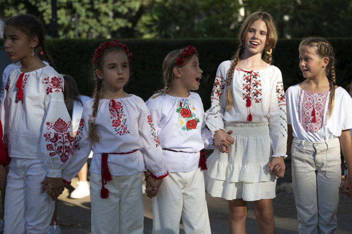 The dance group Green Beans waits for their turn to perform during a Ukrainian Independence Day celebration at the California Capitol in Sacramento on Sunday.